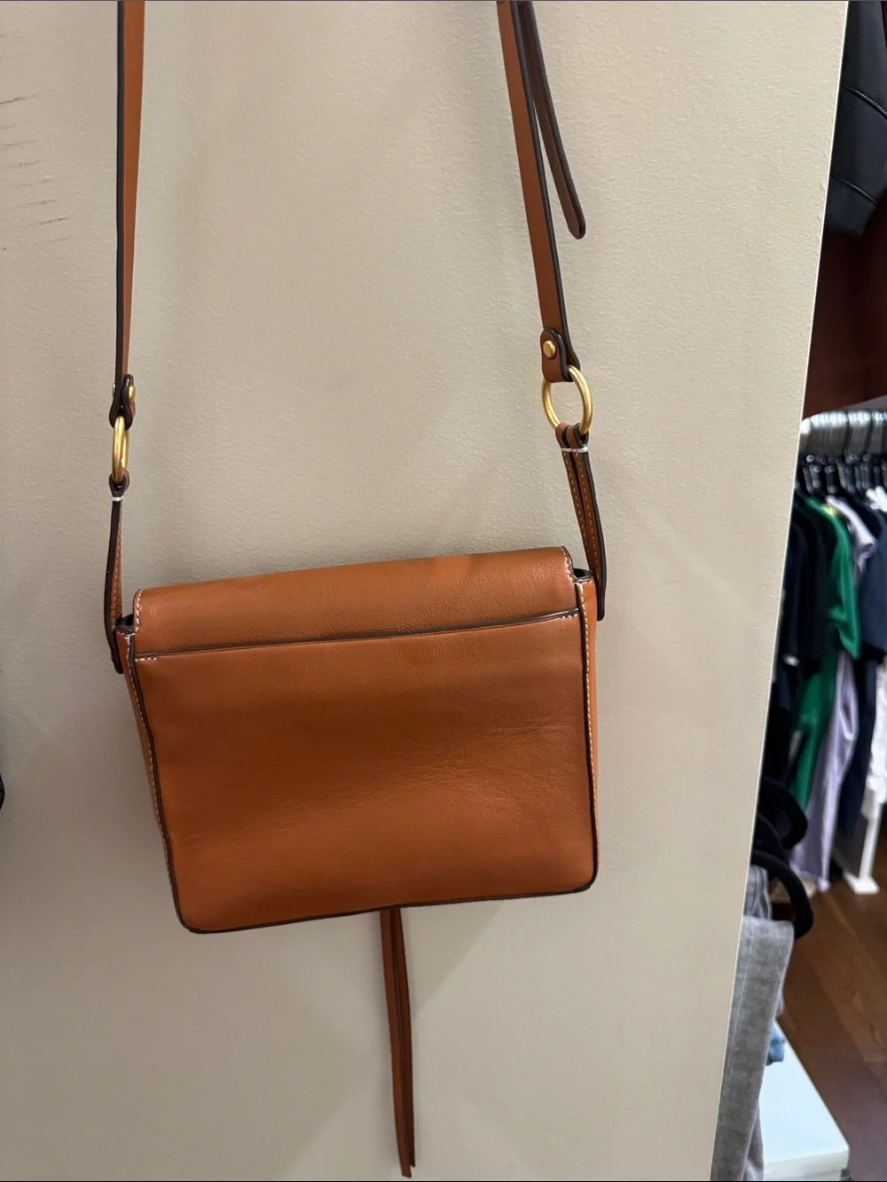 Tory Burch Cognac Leather Logo Tassel Crossbody in excellent condition.